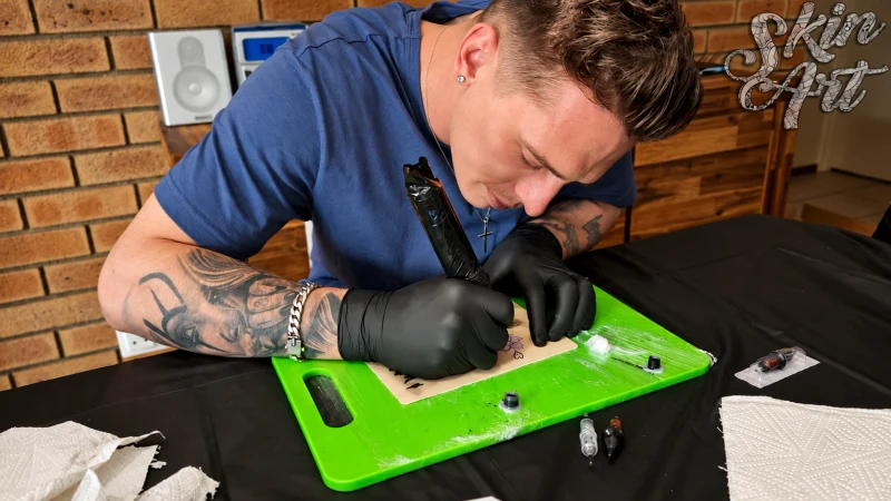 Tattoo technique demonstrated on a practice surface